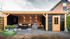 an outdoor living area is shown in the backyard with wood sidings and black furniture