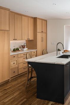 a kitchen with wooden cabinets and an island