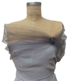 Elegant stunning Gray tulle shoulder wrap great addition for your outfit. Wear this tulle shoulder wrap as a shrug, bolero, caplet, shawl or portrait stole. The perfect cover for your shoulders. Tulle is little stretch and gives you flexibility to move. Rhinestone buttons just for decoration When ordering specify size : XS 0-2 Bust 30-32 SM 2-4 Bust 32-34 Med 6-8 Bust 34-36 LG 10-12 Bust 38-40 XL 14-16 Bust 42-44 For style please choose: 1. Grey rhinestone ball( as listed) 2. None 3. Clear rhine Mog Dresses, Tulle Shawl, Grey Shrug, Evening Wrap, Black Shrug, Evening Wraps, Mother Of Groom Dresses, Bridal Wrap, Wedding Info