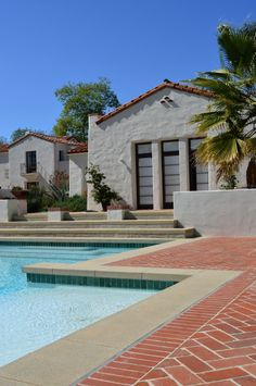 an empty swimming pool with steps leading up to it