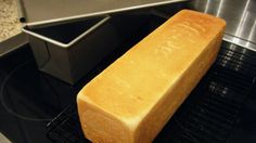 a loaf of bread sitting on top of an oven