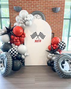 balloons are arranged in the shape of race cars