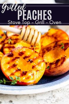 grilled peaches on a plate with a fork