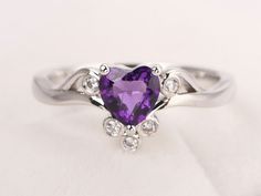 Welcome to my shop, you can find many beautiful gemstone jewelry here, and you also can ask for customized service. Main Stone: 6*6 mm heart cut natural amethyst Accent Stones: cz Metal: 925 sterling silver plated with rhodium. I also can provide metal options such as 14k solid yellow/white/rose gold Setting: prong setting More rings please go to my shop home: https://www.etsy.com/shop/XCjewelryStudio?ref=hdr_shop_menu It's a perfect gift for who born in February (birthstone),it's quite comforta Heart Shaped Amethyst Jewelry For Wedding, Heart-shaped Amethyst Wedding Jewelry, Elegant Heart-shaped Amethyst Ring With Accent Stones, Elegant Amethyst Heart-shaped Birthstone Ring, Purple Gemstone Heart Ring For Wedding, Heart-shaped Purple Amethyst Ring For Wedding, Elegant Heart-shaped Amethyst Ring, Elegant Amethyst Rings For Valentine's Day, Wedding Purple Heart Ring With Gemstone