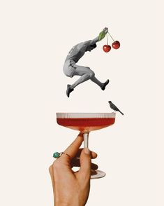 a hand holding a wine glass with cherries floating from it and an image of a baseball player catching a ball