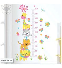 a child's growth chart with animals and flowers on it, next to a window