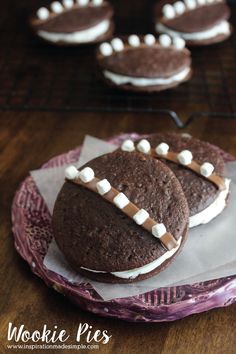 some cookies with marshmallows on them sitting on a plate