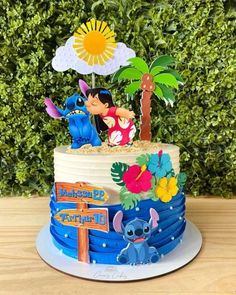 a birthday cake decorated with the characters from disney's animated movie, stitch and stitch