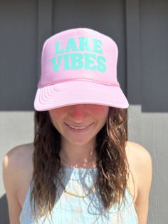 Lake Vibes Pink Trucker hat with blue font. Adjustable back strap and french terry head band. Summer Sports Hats With Letter Print, Beach Snapback Visor Hat With Letter Print, Summer Baseball Cap With Sweatband, Spring Sports Trucker Hat With Flat Brim, Summer Hats With Sweatband, Summer Hats With Sweatband One Size Fits Most, Adjustable Summer Hat With Sweatband, Summer Snapback Visor Hat With Letter Print, Summer Letter Print Snapback Visor Hat