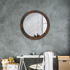 a mirror is hanging on the wall above a desk