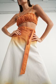 The SIGAL Wrap skirt is a staple resort wear piece. Fully adjustable and with an "A" shape silhouette, it can also be tied above the bust and worn as a dress. Wear as a cover up over your favorite bathing suit or pair with a crop top and sandals for a sophisticated, yet relaxed style. Handcrafted in 100% Cotton fabric, its body is made of one complete piece, the perfect canvas to strategically place the hand painted prints by SIGAL. Ties at waist. "A" line wrap skirt style. One size. It features Beach Long Skirt With Tie Waist, Bohemian Beach Skirt With Tie Waist, Summer Long Wrap Skirt With Tie Waist, Summer Flowy Skirt With Tie Waist, Tie Waist Long Skirt For Summer, Summer Vacation Dress With Wrap-around Straps, Summer Vacation Dresses With Wrap-around Straps, Summer Beachwear Skirt With Tie Waist, Spring Beach Bandeau Skirt