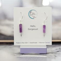 Elevate your style with Mystique - Silver & Amethyst Hook Threaders. These bold sterling silver earrings from our Mystique collection feature a stunning amethyst stone that adds a touch of daring to any outfit. Dare to stand out with these unique hook style threader earrings. Anti-tarnish Sterling Silver Approximately 1.5" in length Genuine Amethyst Gemstones Sent in a Ribboned Gift Box with Polishing Cloth Handmade in Montana Modern Purple Dangle Jewelry, Modern Purple Gemstone Earrings, Modern Amethyst Gemstone Earrings, Modern Amethyst Earrings As Gift, Modern Purple Sterling Silver Earrings, Purple Modern Sterling Silver Earrings, Lavender Sterling Silver Earrings With Ear Wire, Purple Sterling Silver Minimalist Jewelry, Elegant Earrings For Healing