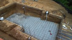 an unfinished swimming pool being built in the ground