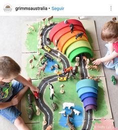 two children playing with toys on the floor in front of an instagramted tweet