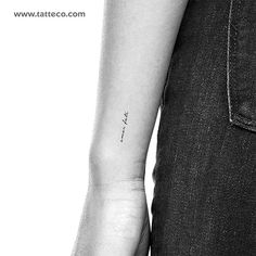 a person with a small tattoo on their arm