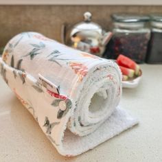 a rolled up towel sitting on top of a kitchen counter