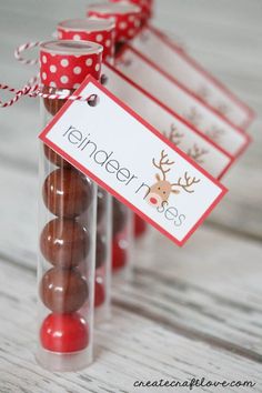 there are chocolate candies wrapped in cellophane and tied with a red polka dot ribbon