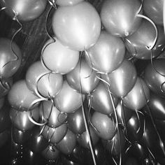 black and white photograph of bunches of balloons