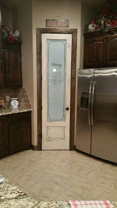 a kitchen with granite counter tops and stainless steel refrigerator freezer next to wooden cabinets