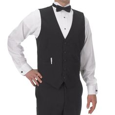 Affordable, stylish, and professional, this Henry Segal men's black basic server vest is the perfect way to complete your staff's uniforms. This vest makes it easy to ensure sophisticated uniformity in your high-end restaurant, banquet hall, casino, or catering operation. This vest is fully lined and tailored specifically for men so your staff always look their best. It also has a full cloth back for a polished, professional look and a five-button front with matching colored buttons for a stylis Bartender Uniform Men, Tuxedo Style Business Vest Sleeveless, Sleeveless Tuxedo Vest For Business, Black Sleeveless Suit With Vest, Classic Sleeveless Sweater Vest For Formal Occasions, Bartender Outfit, Tuxedo Shirt Men, Staff Uniforms, Mens Casual Dress Outfits