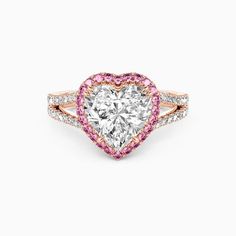 a heart shaped diamond ring with pink and white diamonds