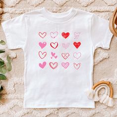 Great shirt for that favorite toddler in your life! Such a sweet shirt and very soft and comfortable. Bella Canvas Kids Rabbit Skins Next Level Heart Tshirt, Valentines Day, Gift, Love Tshirt White T-shirt For Valentine's Day Gift, Playful Graphic Print T-shirt For Valentine's Day, Playful Graphic Print Top For Valentine's Day, Playful White Tops With Heart Graphic, Playful White Heart Print Tops, Playful Short Sleeve Top For Valentine's Day, Cute White T-shirt For Valentine's Day, Cute Heart Print Tops For Valentine's Day, Pink Heart Print T-shirt For Valentine's Day