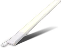 a white light that is on the side of a wall or ceiling with a cord attached to it