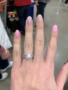 a woman's hand with a ring on it