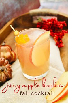 an apple bourbon cocktail is served in a glass