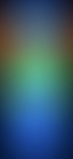 a blurry image of blue and green colors