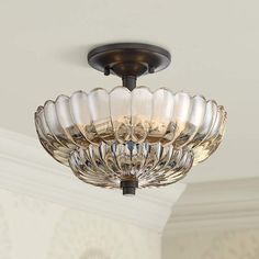 a large glass bowl ceiling light fixture