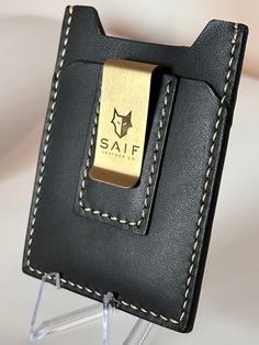 Our money clip wallet is Handstitched to perfection. Stylish, slim and practical card holder which will fit up to 8 cards without getting bulky. Removeable money clip can be detached and fits up to 20 bills. Bifold Card Holder With Belt Clip For Daily Use, Daily Use Bifold Card Holder With Belt Clip, Leather Rectangular Card Holder For Everyday Carry, Black Rectangular Wallet With Belt Clip, Classic Leather Card Holder With Key Clip, Daily Use Card Holder With Belt Clip, Classic Card Holder With Key Clip For Daily Use, Rectangular Card Holder With Belt Clip For Everyday Use, Everyday Rectangular Card Holder With Belt Clip