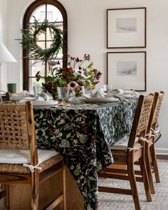 a dining room table is set with place settings