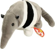 an elephant stuffed animal with a tag on it's neck