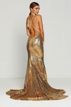 The Gigi Gown is a stunning mermaid fit dress with a v-neck and lace up back. The sequinned material is stretchy and it is lined to the hem. There is a hidden zipper on the back. What is a Made-To-Order? This product is a made-to-order item. Made-to-order items are not held in physical stock and production commences AFTER order placement. We try to limit production and stock levels and as such, made-to-order items produce less waste and allow you to purchase your dream gown without the chance of Prom Dresses Long Blue Royals, Formal Dresses Knee Length, Gold Sequins Dress, Prom Dresses Gold, Formal Dresses Mermaid, Gold Formal Dress, Metallic Dresses, Sparkly Dresses, Mermaid Fit