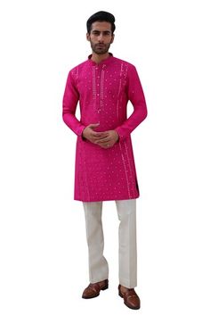 Hot pink full sleeves kurta with floral mirror jaal embroidery. Paired with an ivory pant. - Aza Fashions Navratri Long Sleeve Sherwani With Gota Work, Navratri Sherwani With Gota Work And Long Sleeves, Chanderi Bandhgala With Mirror Work And Long Sleeves, Long Sleeve Chanderi Bandhgala With Mirror Work, Festival Long Sleeve Sherwani With Gota Work, Pink Chanderi Long Sleeve Sherwani, Navratri Long Sleeve Sherwani With Mirror Work, Long Sleeve Sherwani With Mirror Work For Navratri, Traditional Long Sleeve Sherwani With Gota Work