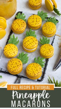 pineapple macarons on a cooling rack with lemons in the background