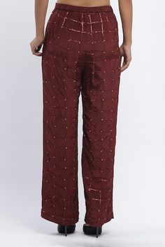 Burgundy trouser with all over dot chequered prints and sequin embroidery. - Aza Fashions Festive Straight Pants For Workwear, Festive Traditional Workwear Bottoms, Festive Workwear Straight Pants, Festive Semi-stitched Pants With Resham Embroidery, Festive Cotton Bottoms For Workwear, Bohemian Stretch Ankle-length Pants, Bohemian Embroidered Ankle-length Pants, Red Semi-stitched Chanderi Embroidered Fabric, Red Cotton Ankle-length Harem Pants