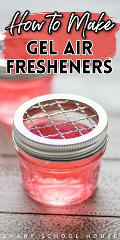 a jar filled with gel air fresheners sitting on top of a wooden table