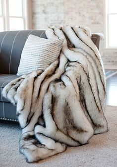 a couch with a blanket on top of it