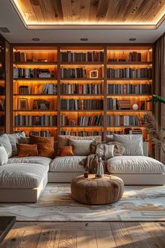 a living room filled with lots of bookshelves next to a couch and coffee table