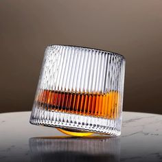 an empty glass sitting on top of a table