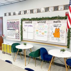 a classroom with desks, chairs and bulletin boards on the wall in front of them