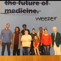 a group of people standing next to each other in front of a sign that reads the future of medicine weezer