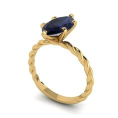 a yellow gold ring with an oval blue sapphire stone in the center and twisted band