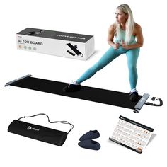 a woman sitting on top of a yoga mat next to an exercise board and accessories