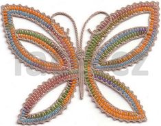 a multicolored butterfly broochle on a white background