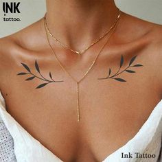 a woman's chest with tattoos on it and the words ink tattoo above her chest