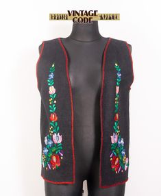 Hungarian traditional black felted wool vest with hand embroidered flowers, so called Matyo Kalocsa embroidery.  The embroidery is made with silky a bit shiny threads. There are no closure. This vest  is quite lightweight. Could be used unisex vest   CONDITION The vest is in good condition, there are no holes, stains or other damages, not much used SIZE: not tagged,  the vest looks like Large to XL size,  BUT  Please read the measurements below carefully ! Our dummy Mathilda is Large / Extra large with bust 99 cm / 39", waist: 77 cm / 30", hips 105 cm / 41" MEASUREMENTS Length: 66 cm/ 26"  Bust : 106 cm / 41.6"  ( there is no closure, measurements are taken flat, I have put to sides together) Armhole:  56 cm / 22" Questions are always welcome! To see more clothing look in my shop https://w Kalocsa Embroidery, Hand Embroidered Flowers, Wool Vest, Black Felt, Vest Outfits, Boho Vintage, Felted Wool, Vintage Boho, Embroidered Flowers