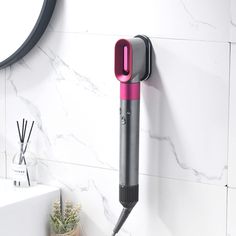 PRICES MAY VARY. ORGANIZE YOUR HAIR TOOLS: Keep your Dyson Airwrap Styler neatly organized with this metal wall mount holder. SAVE SPACE: Free up valuable counter space in your home, bedroom, or bathroom with this stylish and functional storage rack. EASY ACCESS: The wall mount design allows for easy access to your styling tools, eliminating the hassle of searching for misplaced accessories. DURABLE CONSTRUCTION: Made of high-quality metal, this organizer rack is sturdy and secure, ensuring your Hair Curling Wand, Styler Hair, Metal Organizer, Bathroom Trays, Wall Mounted Hair Dryer, Dyson Hair Dryer, Dyson Airwrap, Accessories Organizer, Iron Accessories